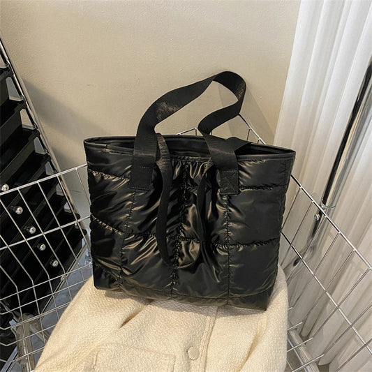 Black Quilted Tote Bag on a white jacket